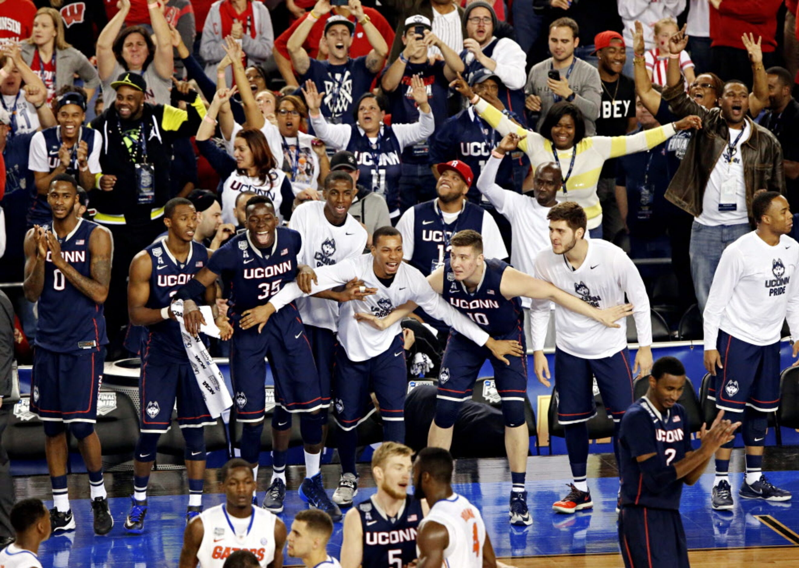 The Connecticut Huskies bench erupts at their win during the second half of their NCAA Final...