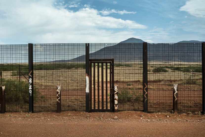 A border fence maintained by the Homeland Security Department sits on private property in...