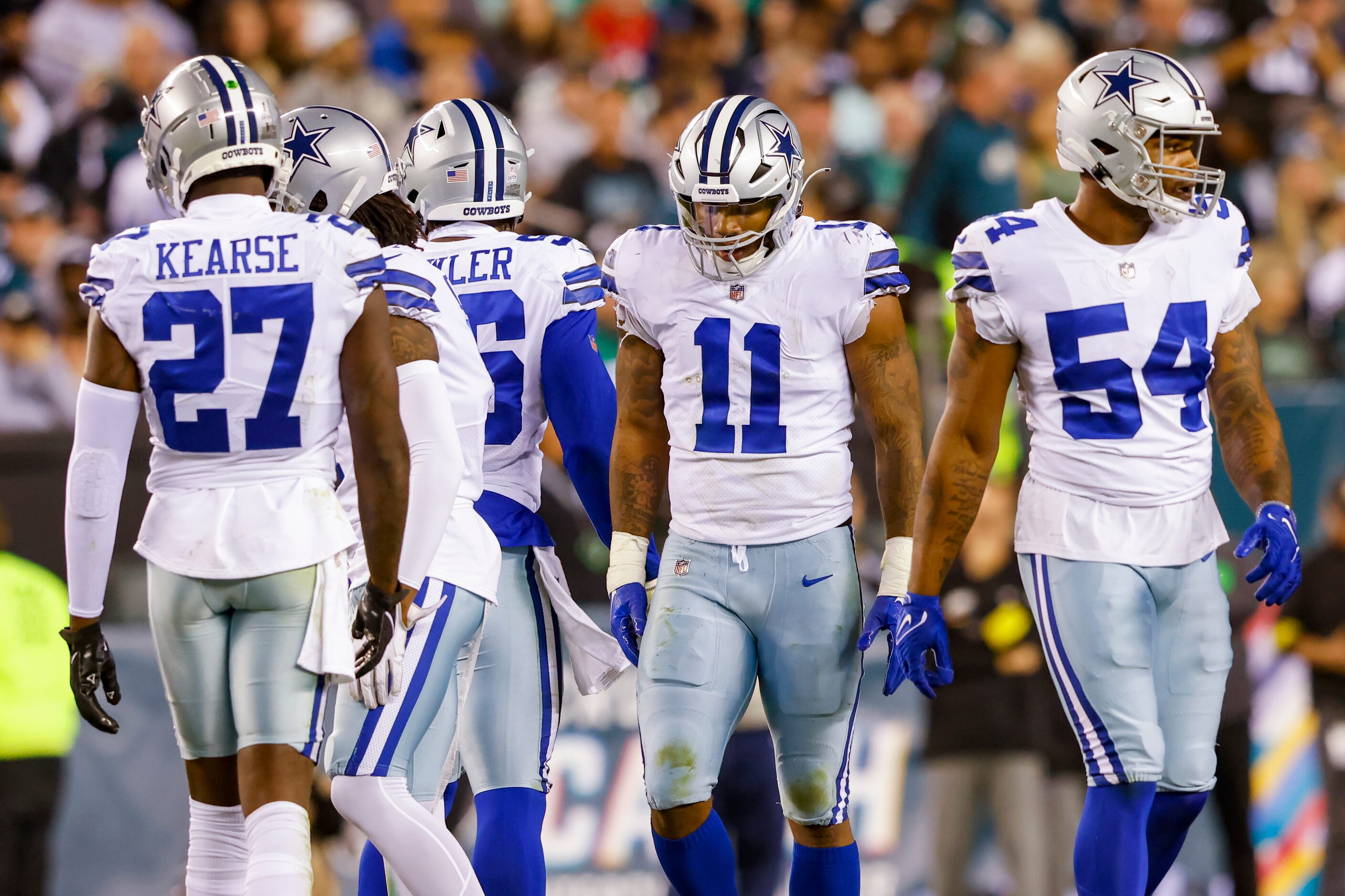 Dallas Cowboys linebacker Micah Parsons (11) puts his head down after a referees call during...