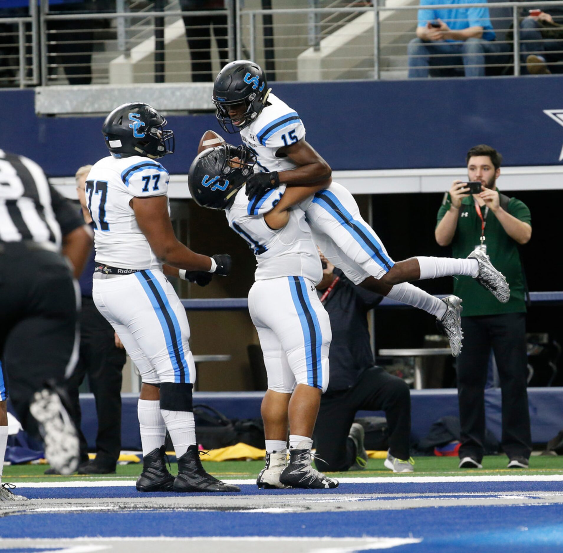 Shadow Creek's Jared Jackson (15) is lifted by Corey Smith (61) after he catches a touchdown...