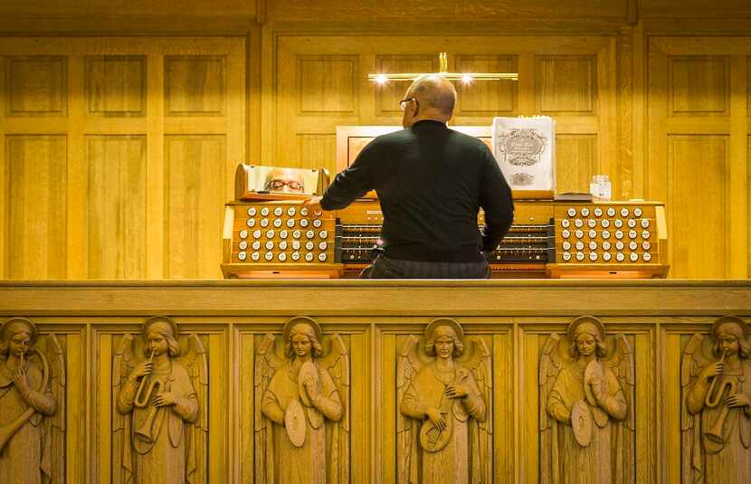 
Organist Henry McDowell plays the new organ at Christ the King Catholic Church on...