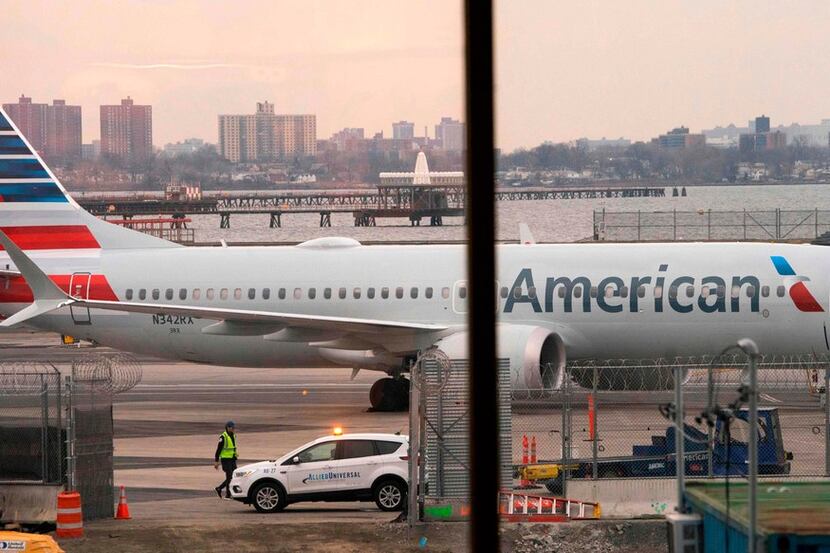 In this file photo taken on March 13, 2019 an American Airlines 737 Max sits at the gate at...