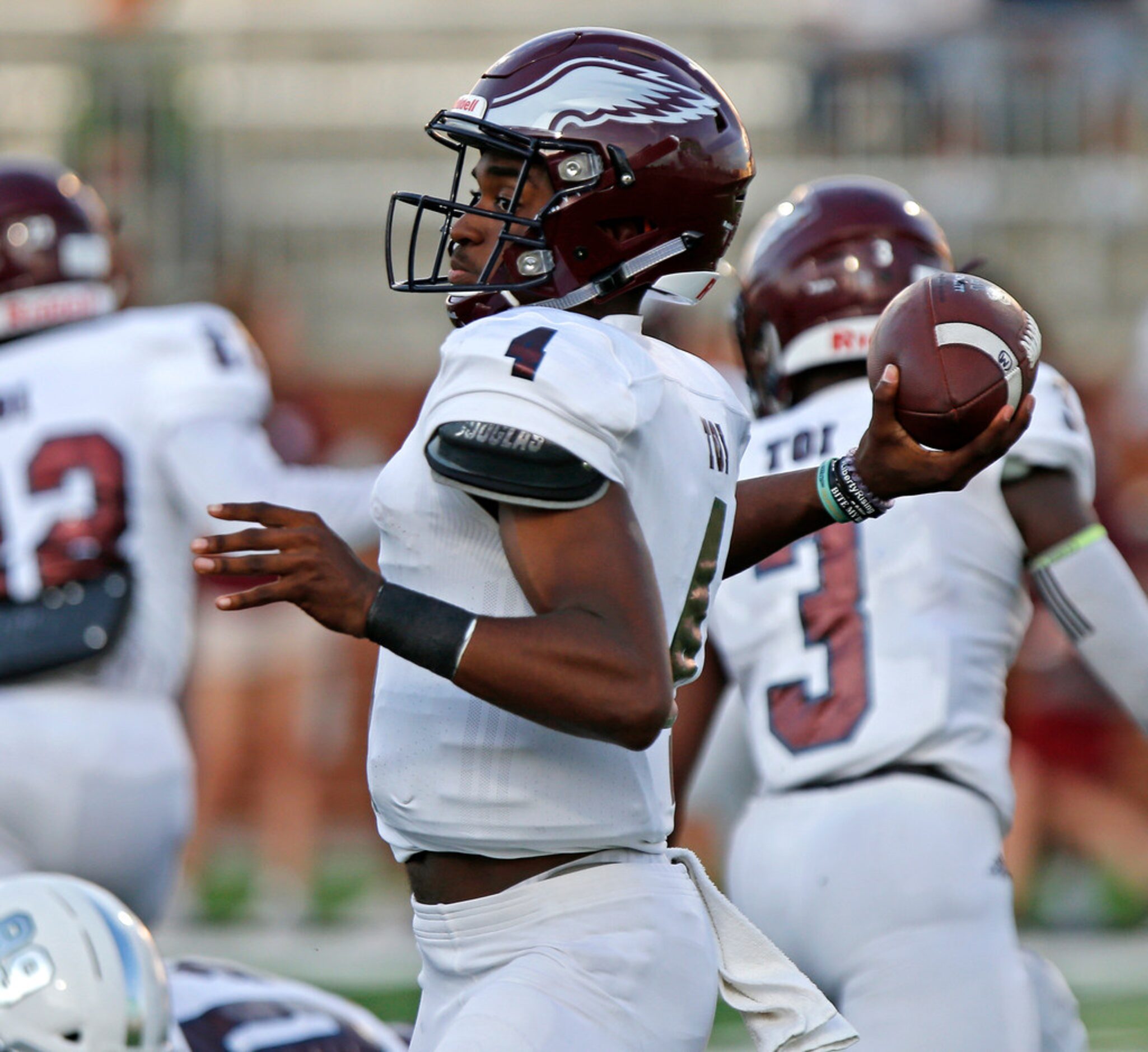 Rowlett High School quarterbacked Alex Routt (4) throws a pass during the first half as...