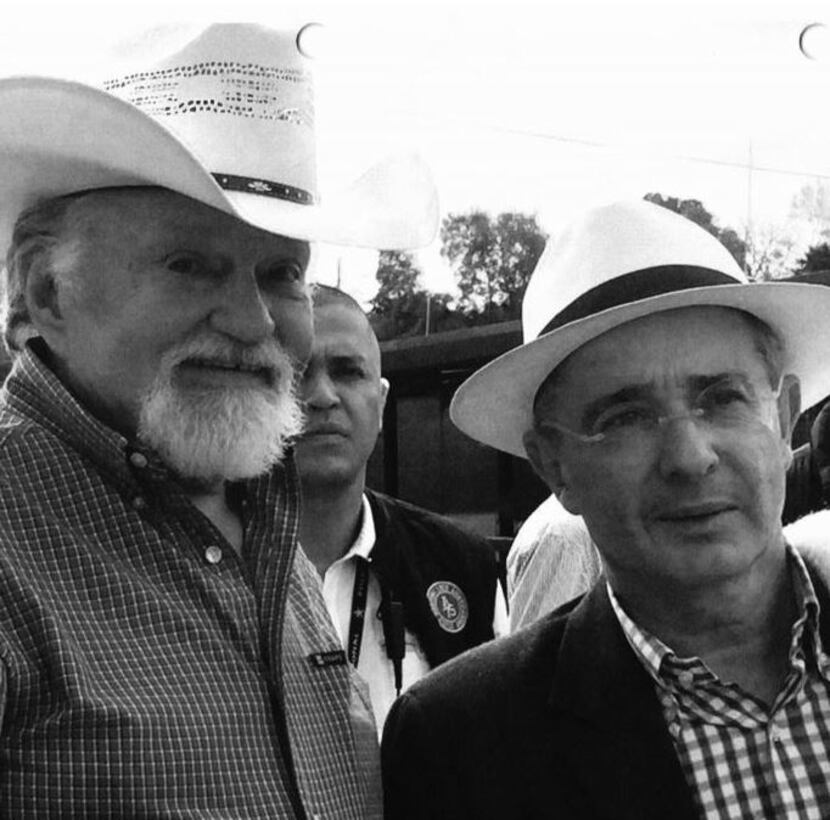 Chuck Morgan (left) with Alvaro Uribe, the former president of Colombia.