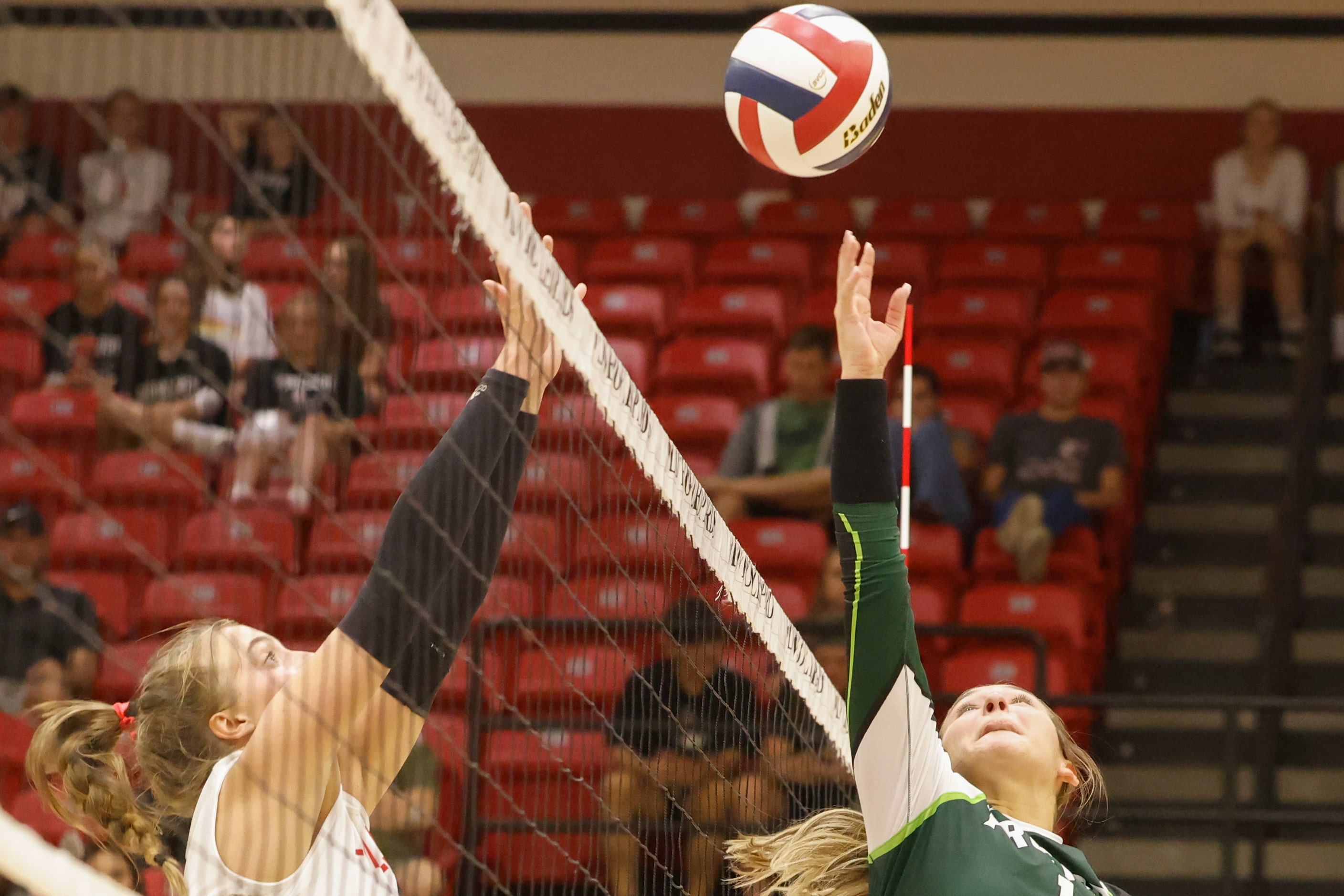 Prosper’s Callie Kieffer, right, attempts to hit the ball as Lovejoy’s Anna Barr attempt to...