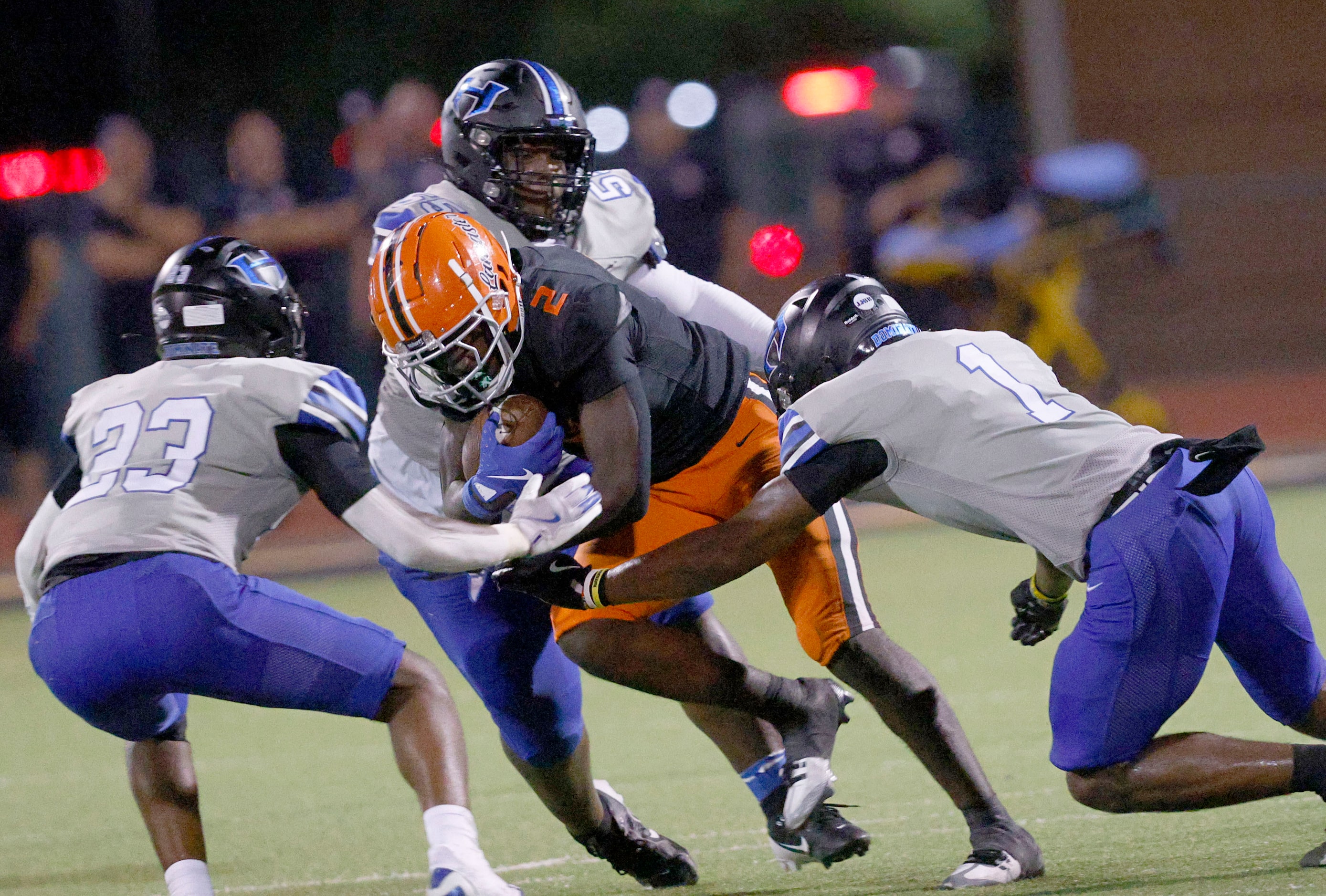 Lancaster’s Izayah Lee keeps a ball away from Hebron’s Jashua Turner (23), Ayson McCray...