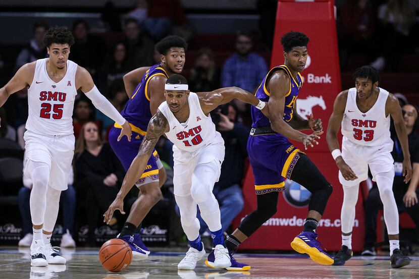 Southern Methodist's Jarrey Foster (10) drives down the court against East Carolina on...