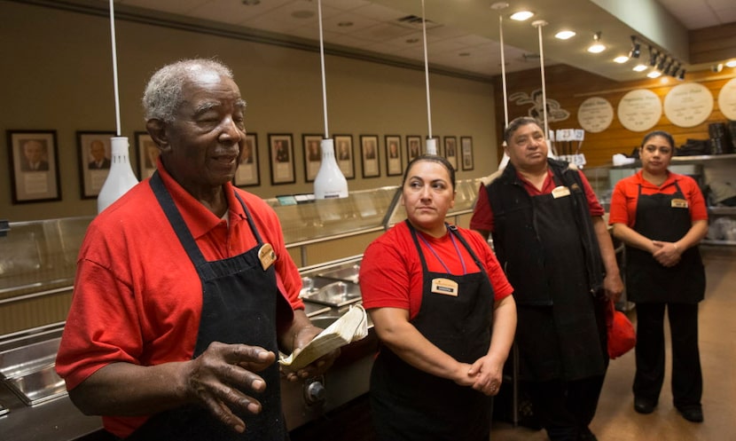 Ernest Bowens reads Matthew 13:10 to his co-workers during a pre-shift devotional at...