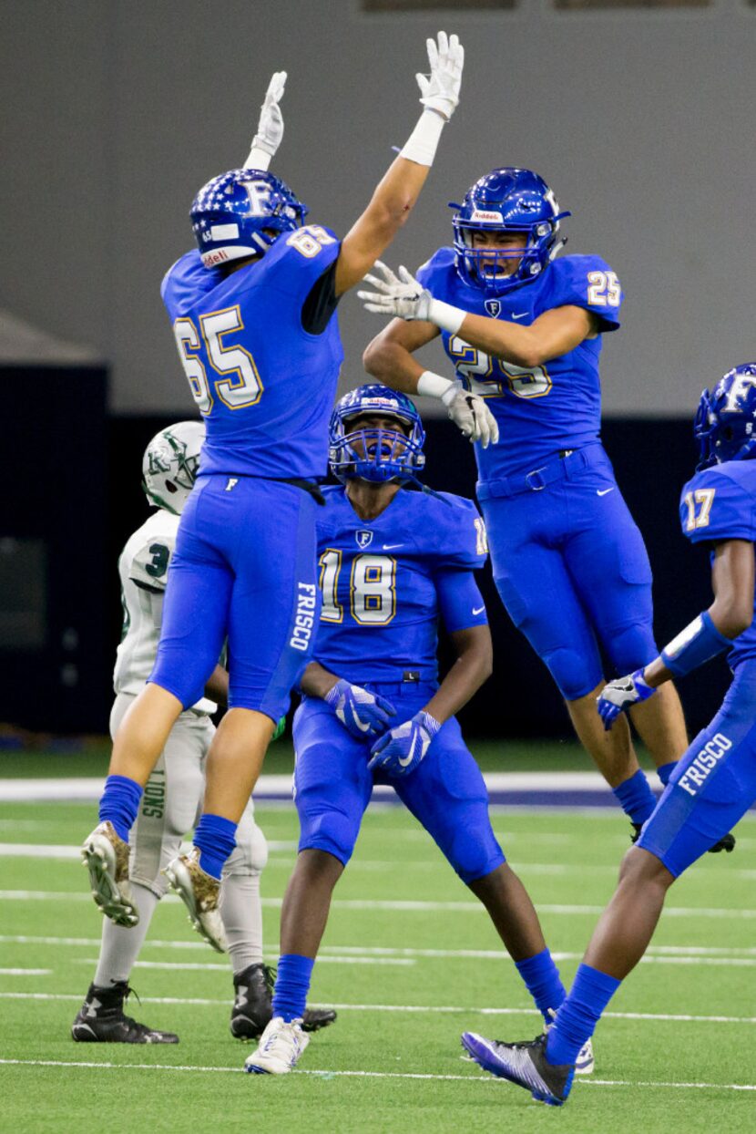 Frisco Raccoons Vincent Ton (65) and Dan Ton (25) celebrates a sack during the varsity...