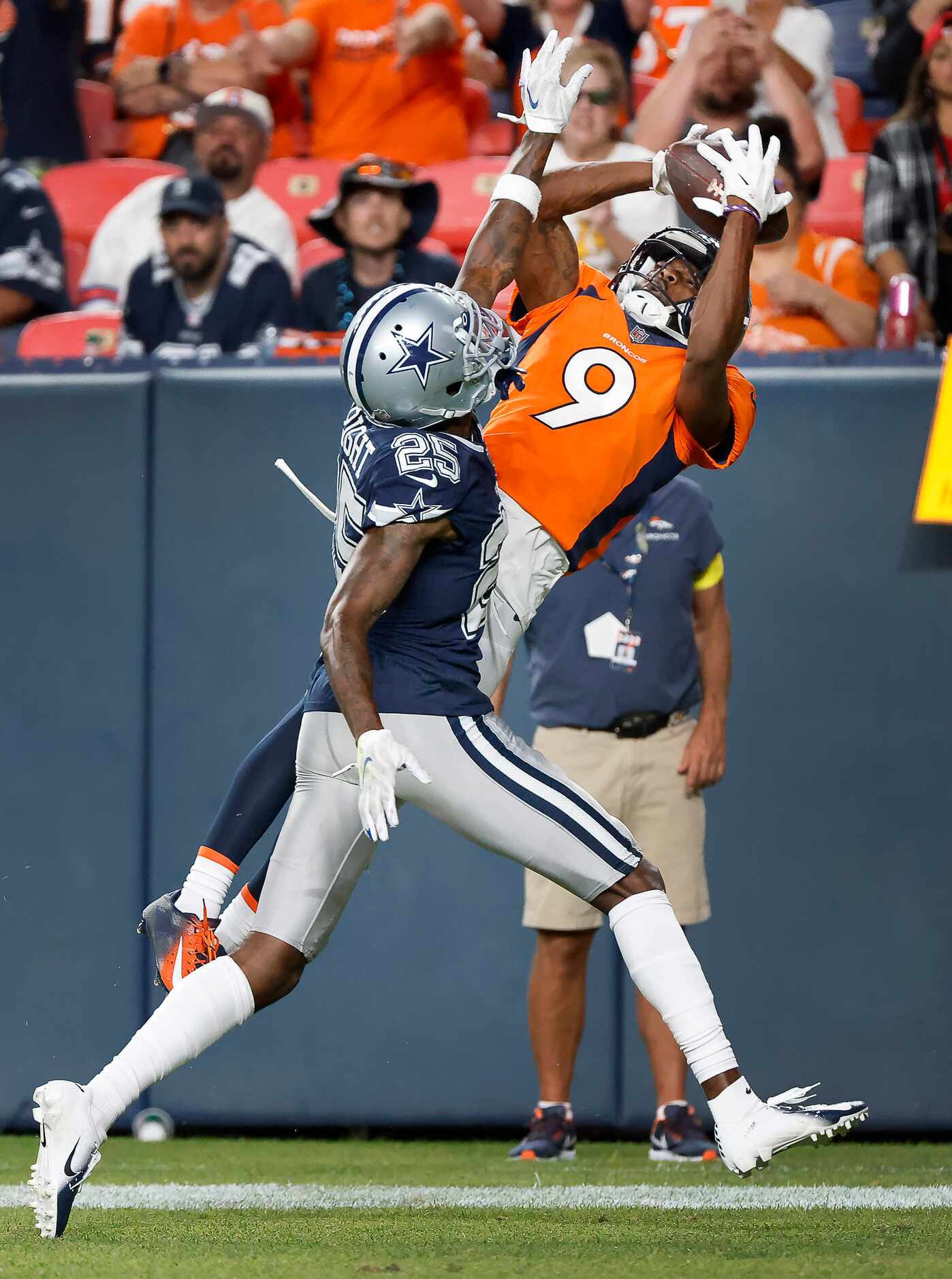 Denver Broncos wide receiver Kendall Hinton (9) pulls down a touchdown pass in front of...
