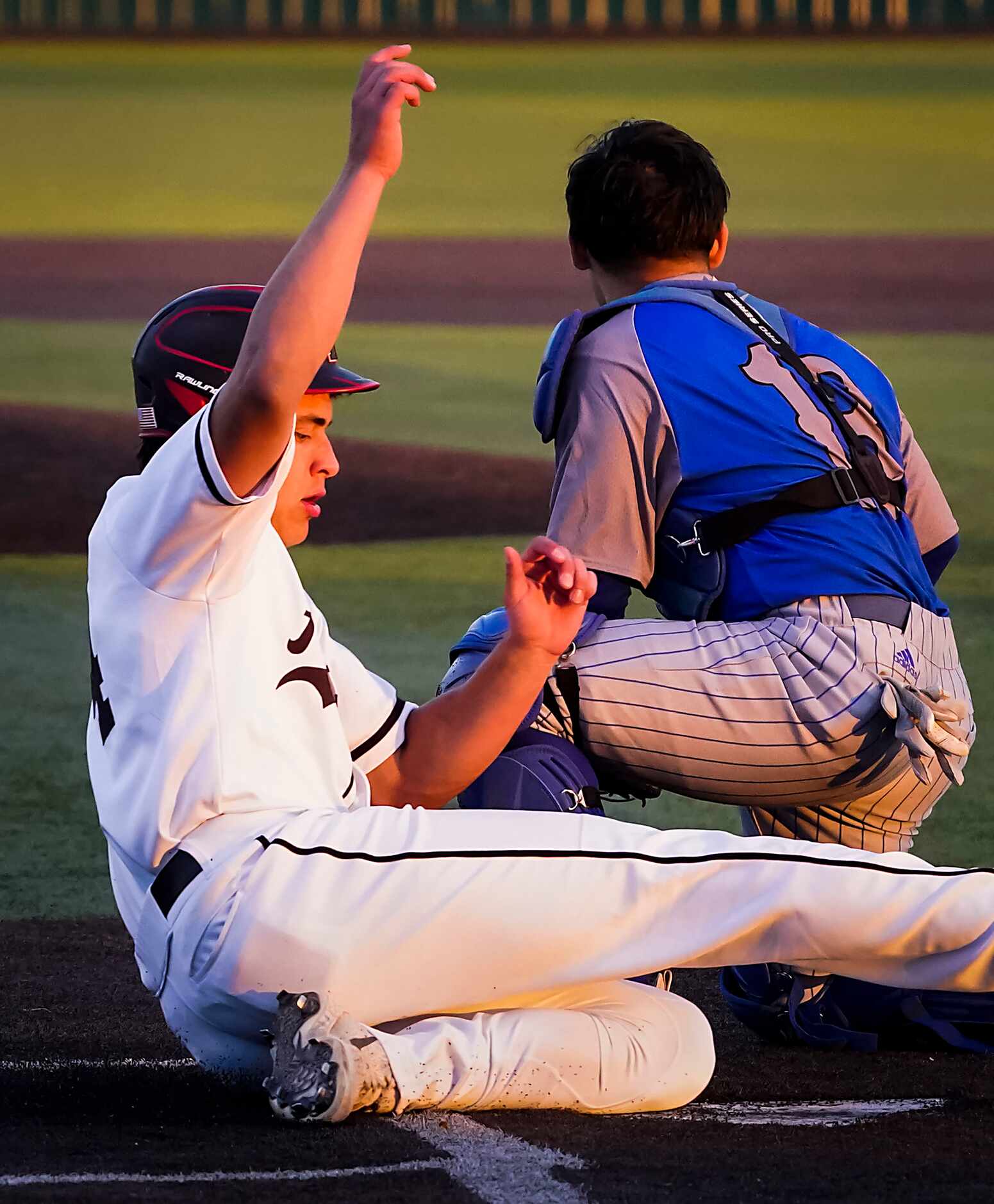 Rockwall-Heath’s Matthew Witt scores ahead of a tag vrom North Mesquite catcher Chris Cobos...