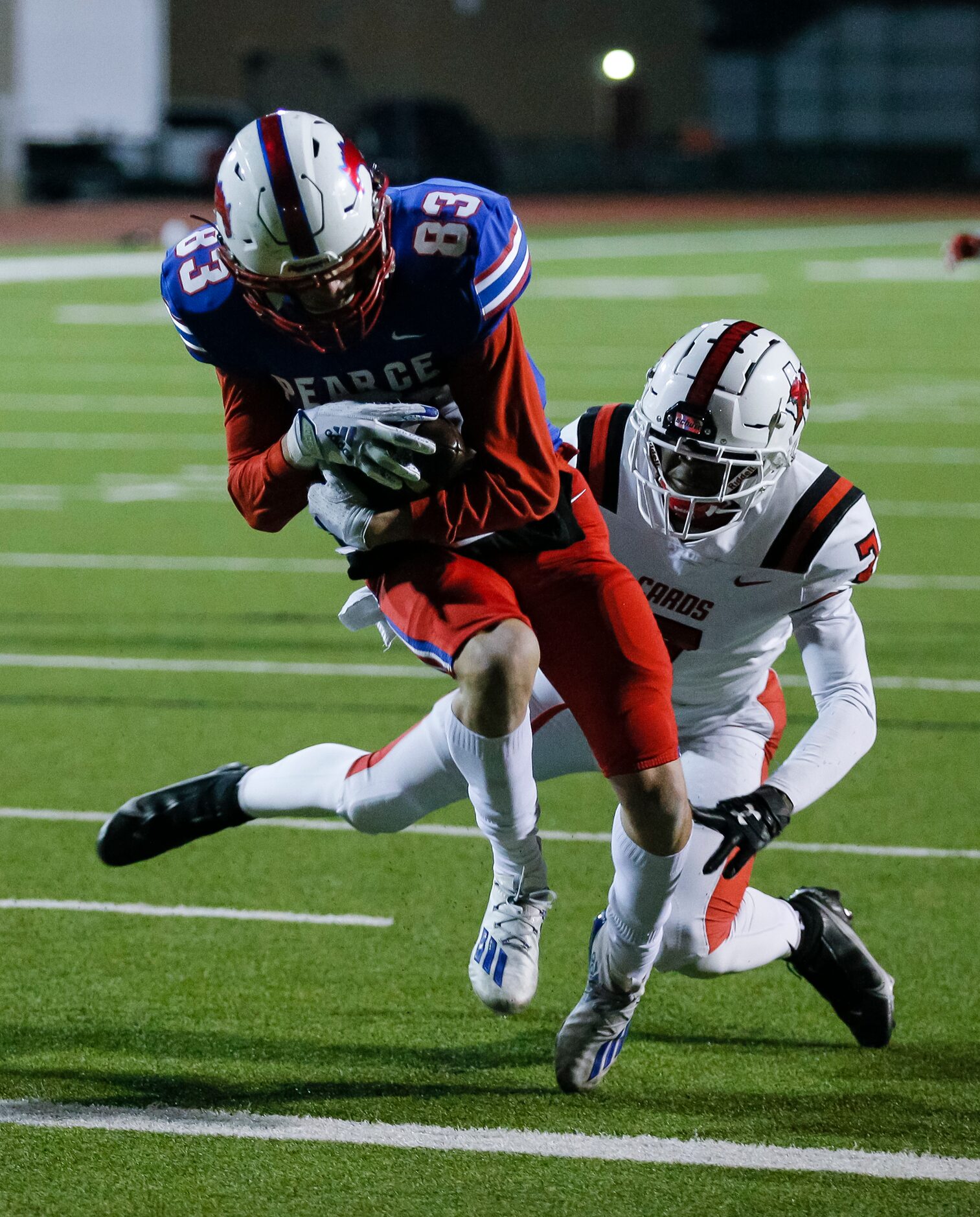 JJ Pearce freshman wide receiver Parker Livingston (83) breaks a tackle by Irving MacArthur...