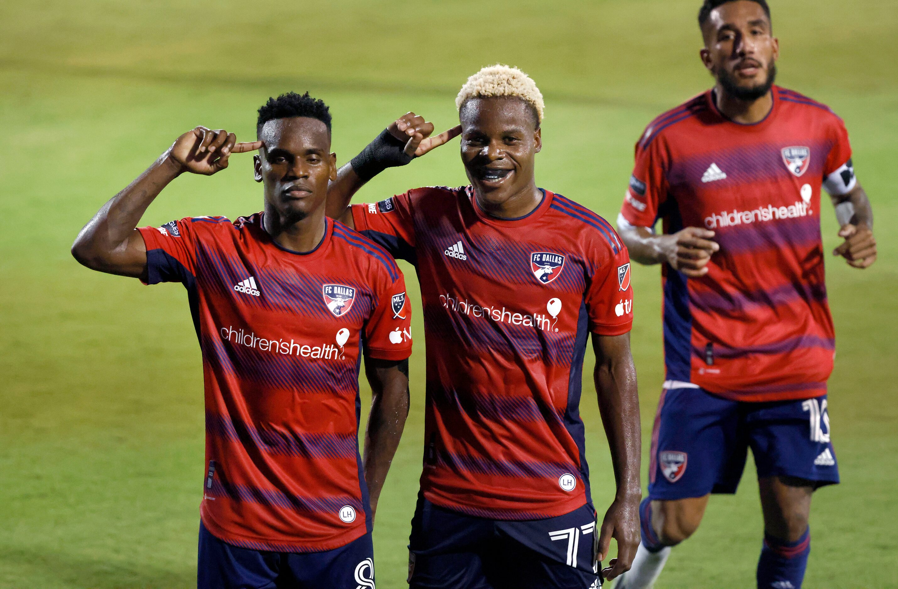 FC Dallas forward Bernard Kamungo (77) pose for photos with forward Jáder Obrian (8) after...