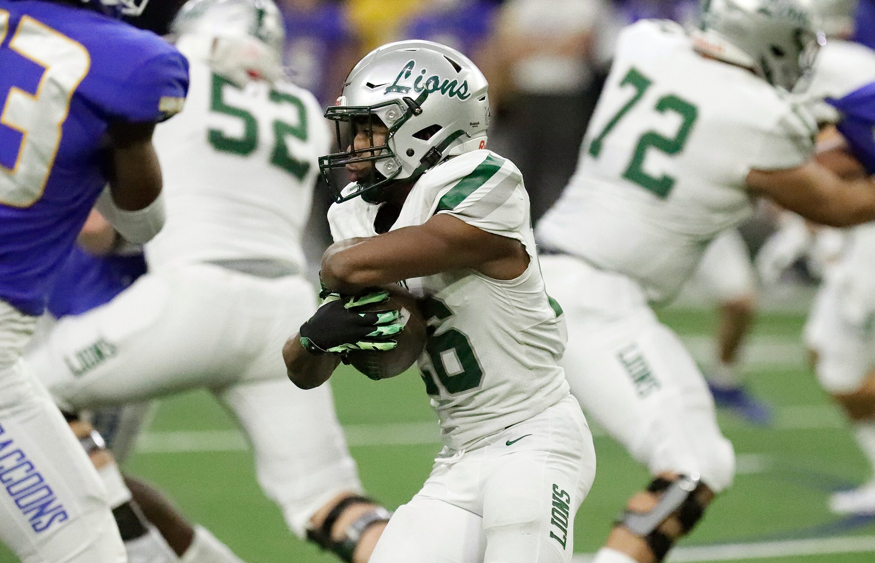 Reedy High School running back Triston Airy (26) runs for yardage during the first half as...