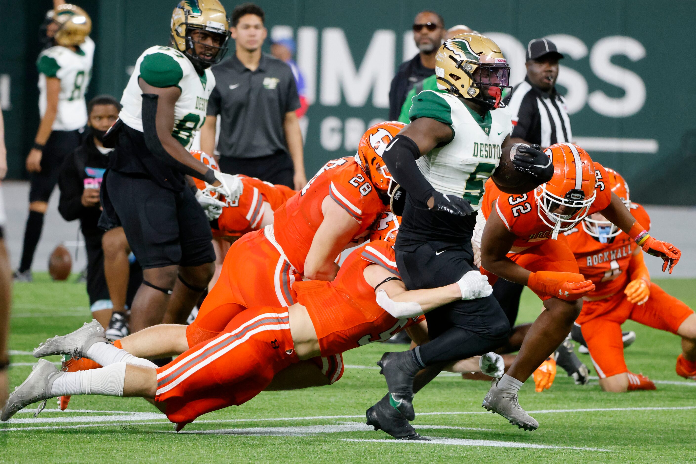 Rockwall defenders, including Jarrett Stoner, bottom, Aiden Barrera (28) and Jaylen Jones...