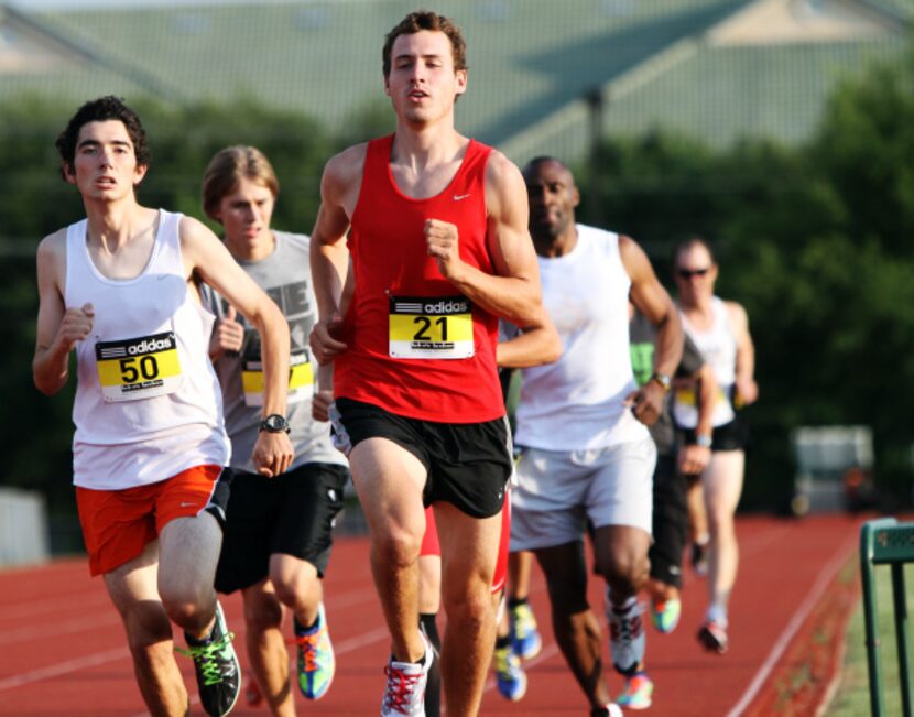 Cameron Jackson, 17, left, and Brian Cooper, 28, compete in the 400 meter race during the...