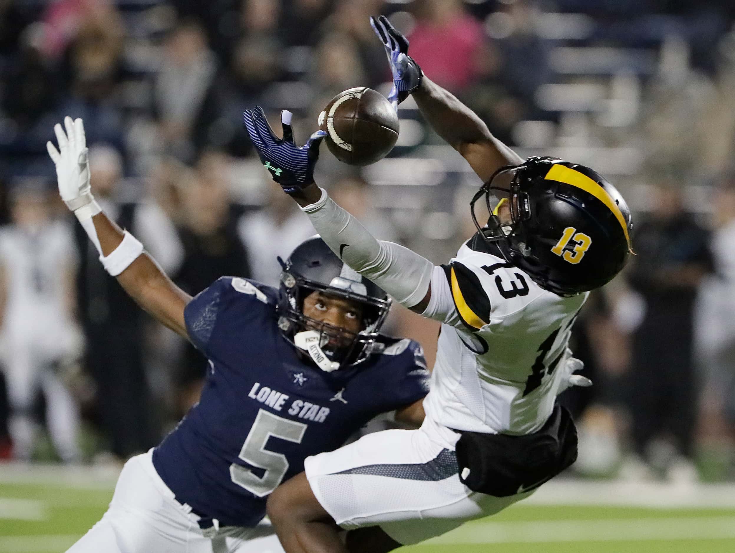 Forney High School wide receiver Imari Jehiel (13) was unable to make the catch defended by...
