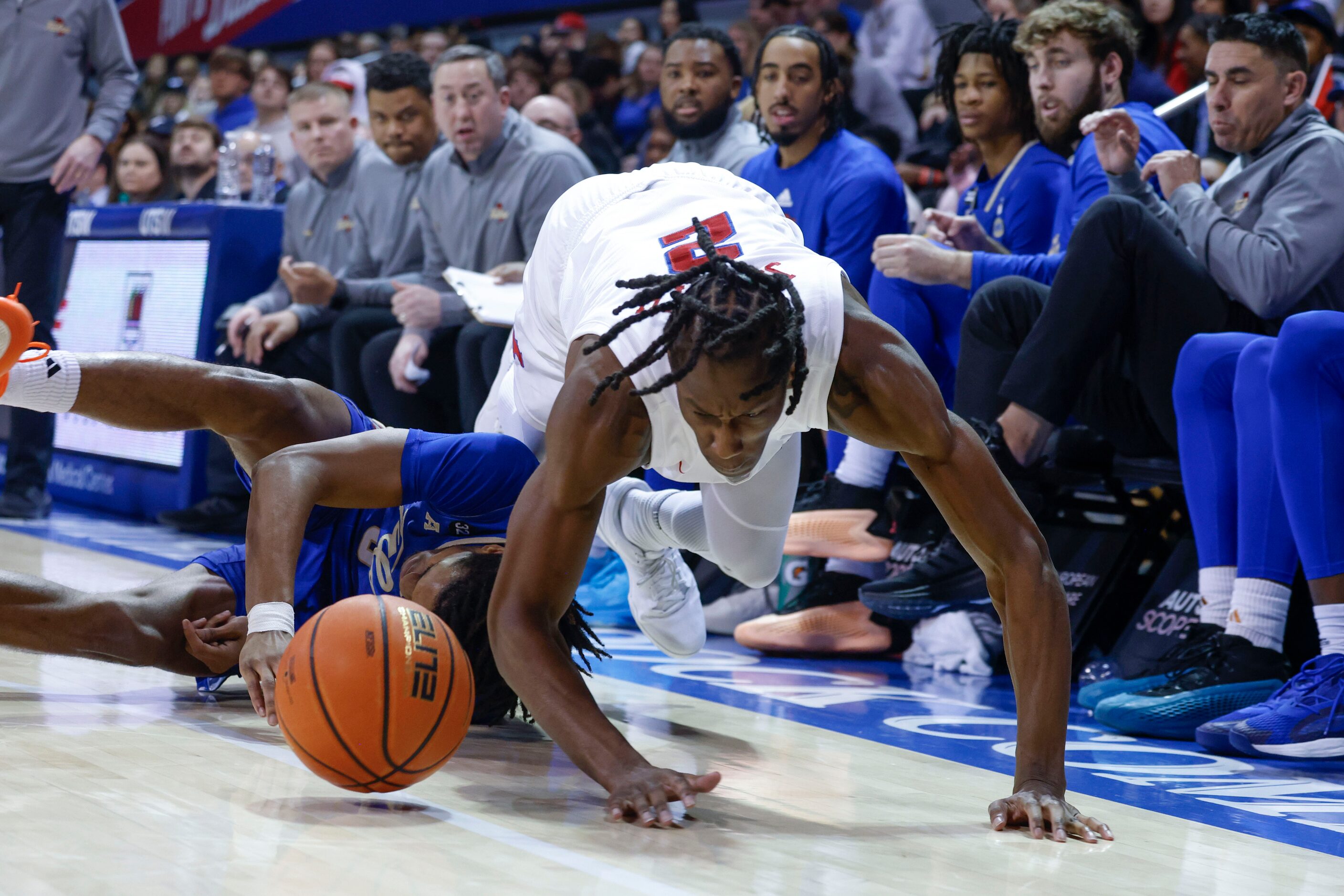 Tulsa guard Jesaiah McWright (left) collides with Southern Methodist guard Jalen Smith...