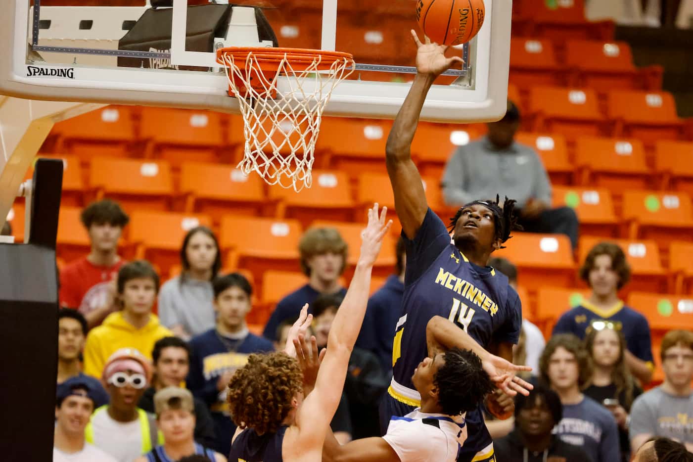 Mckinney’s Ale Anamekwe (14) blocks a shot by North Crowley’s Trey Davis (3) during the...
