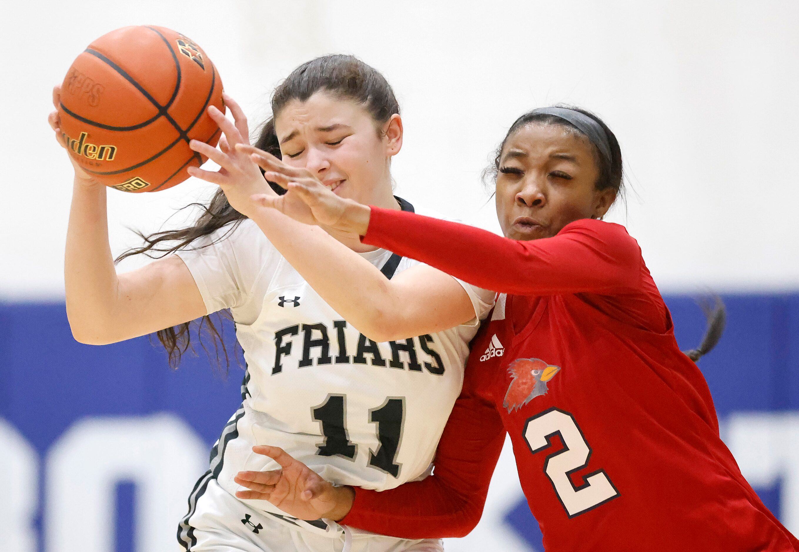 John Paul II guard Sydney Wade (2) tries to swat the ball away from Bishop Lynch guard...