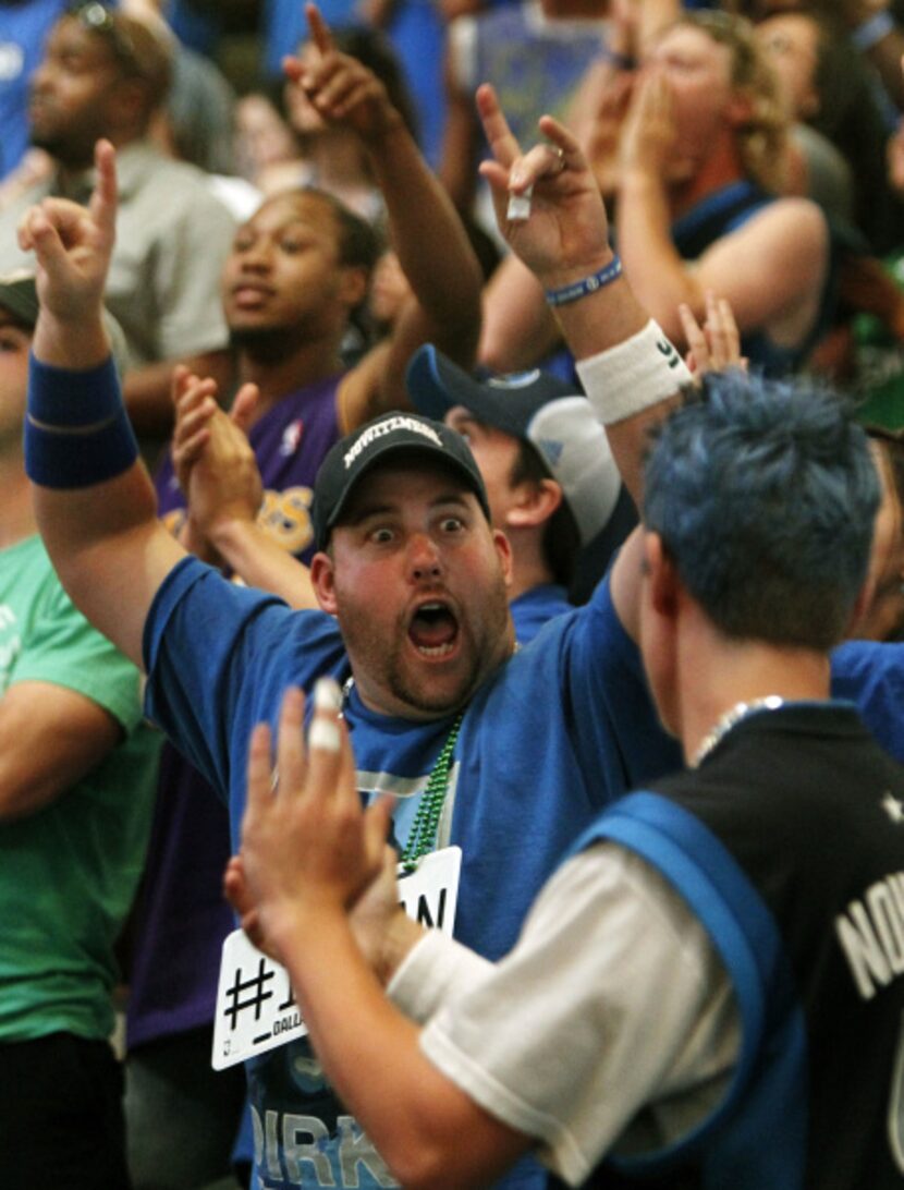 Mavericks fan Thad Bouton cheers for his team during the watch party at the American...