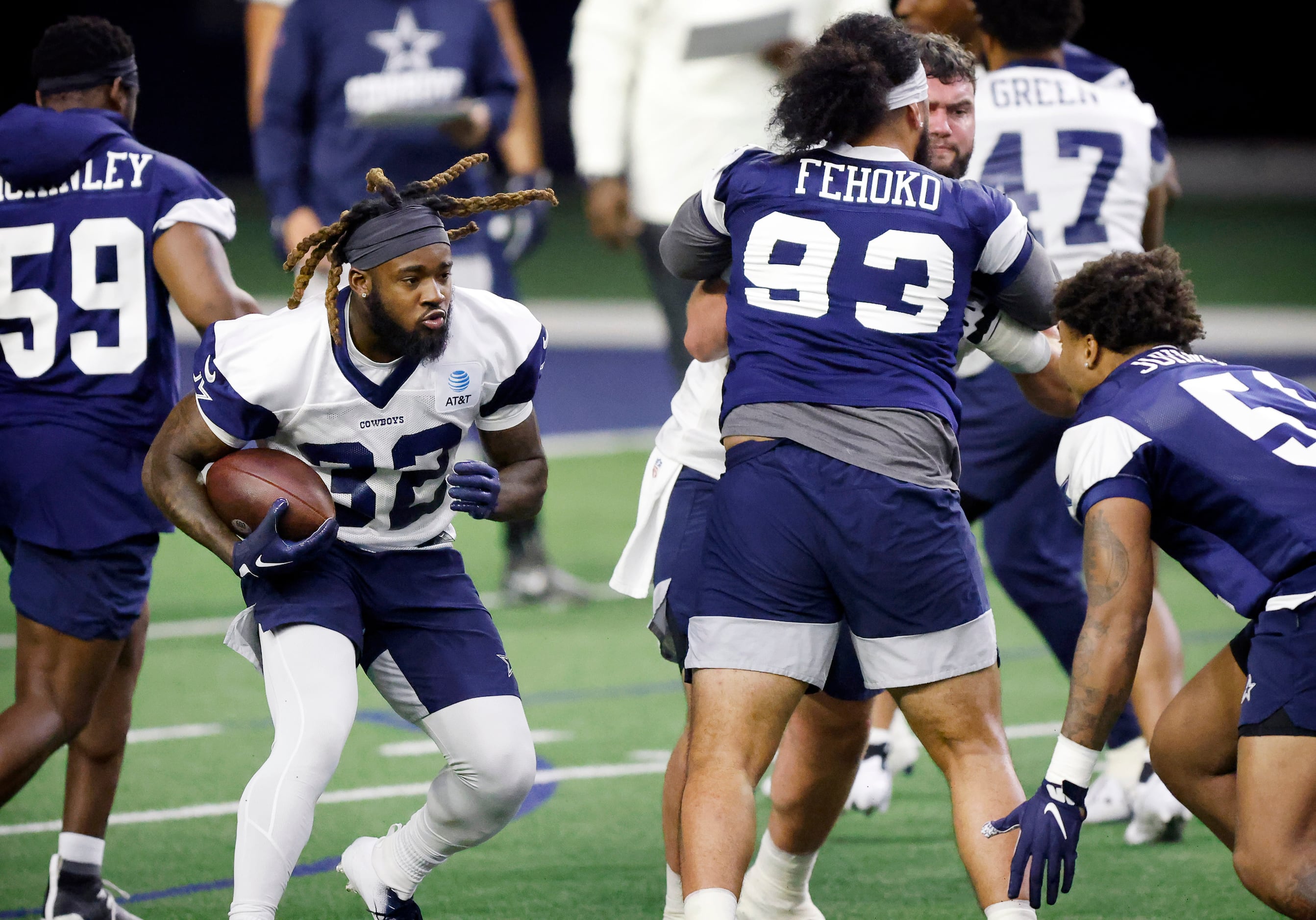 Dallas Cowboys running back Ronald Jones (32) carries the ball during a mini camp session at...