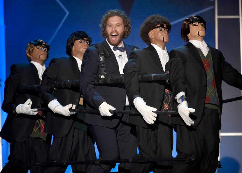 Host T.J. Miller, center, performs on stage at the 21st annual Critics' Choice Awards at the...