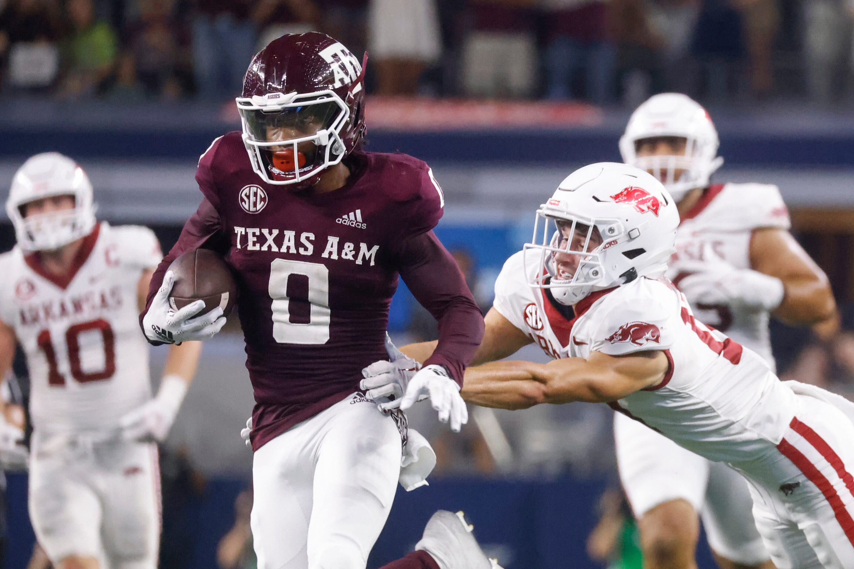 Texas A&M defensive back Myles Jones (0) runs for a touchdown past Arkansas defensive back...