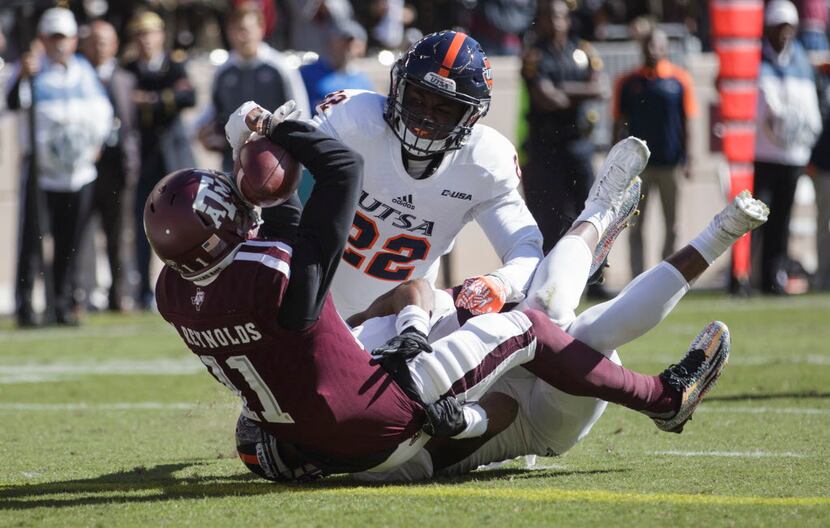 Texas A&M wide receiver Josh Reynolds (11) falls backwards into the end zone for a touchdown...