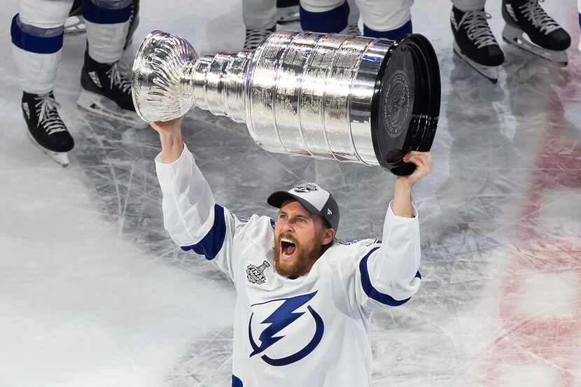 Blake Coleman (20) of the Tampa Bay Lightning hoists the Stanley Cup after defeating the...