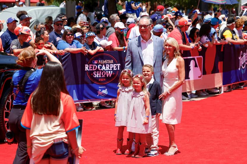 Texas Rangers manager Bruce Bochy poses for a photo with his wife Kim Seib and family during...