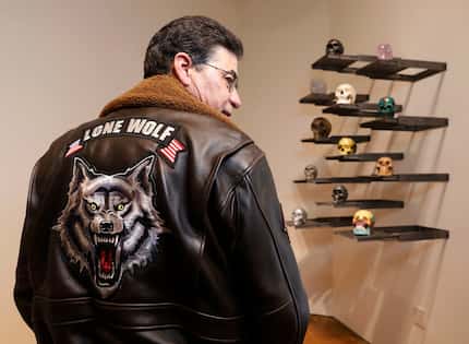 Bobby Haas has a leather jacket that features a snarling wild animal beneath the words "Lone...