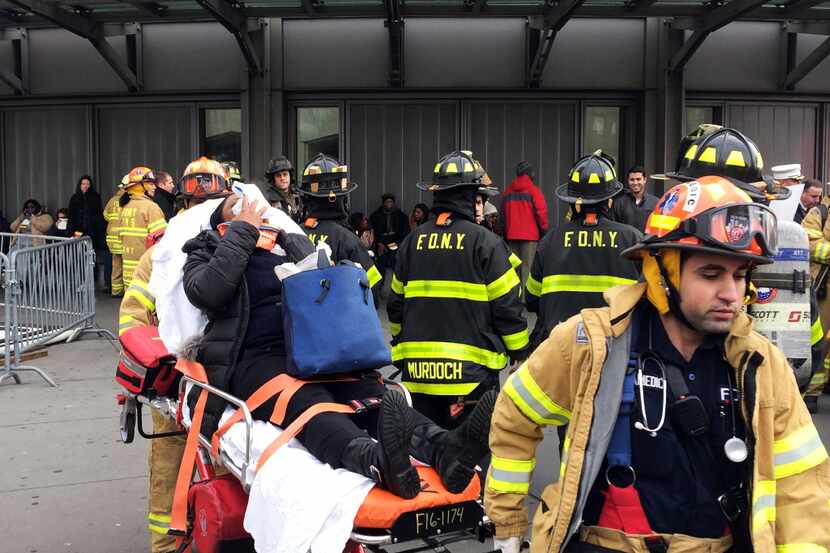An injured passenger, after a Long Island Rail Road commuter train either hit something or...