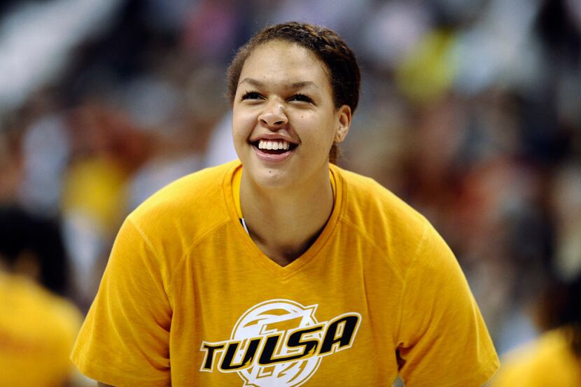 Tulsa Shock's Elizabeth Cambage smiles during warm ups before a WNBA basketball game against...