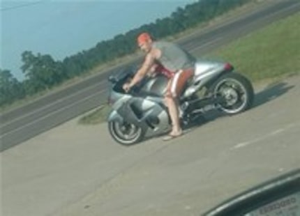 Photo of Anthony Braddick Welsh on a motorcycle in Liberty County with his young son