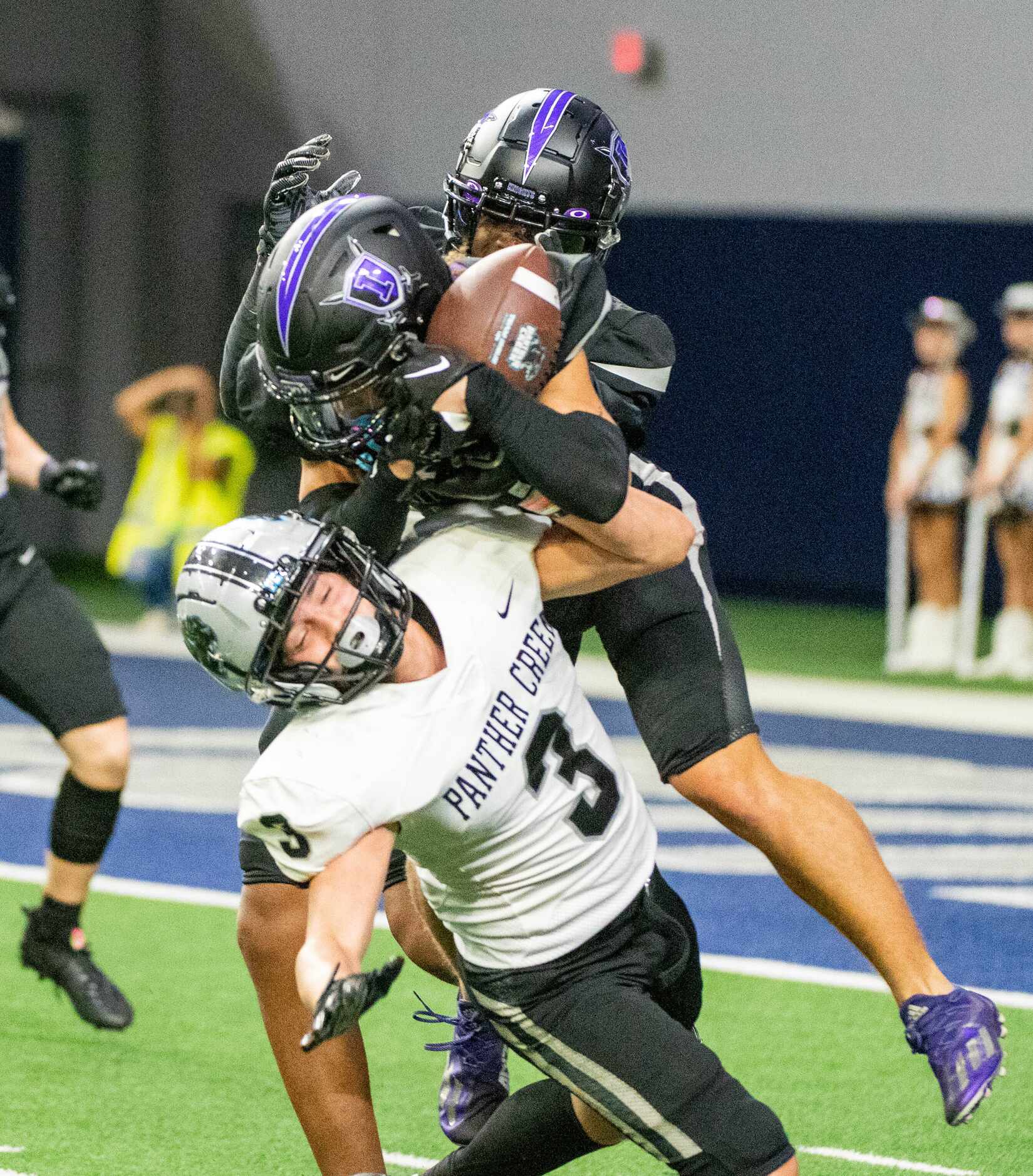 Independence’s Elijah Knott, middle, and Christian Gibson, right, defend on a pass intended...