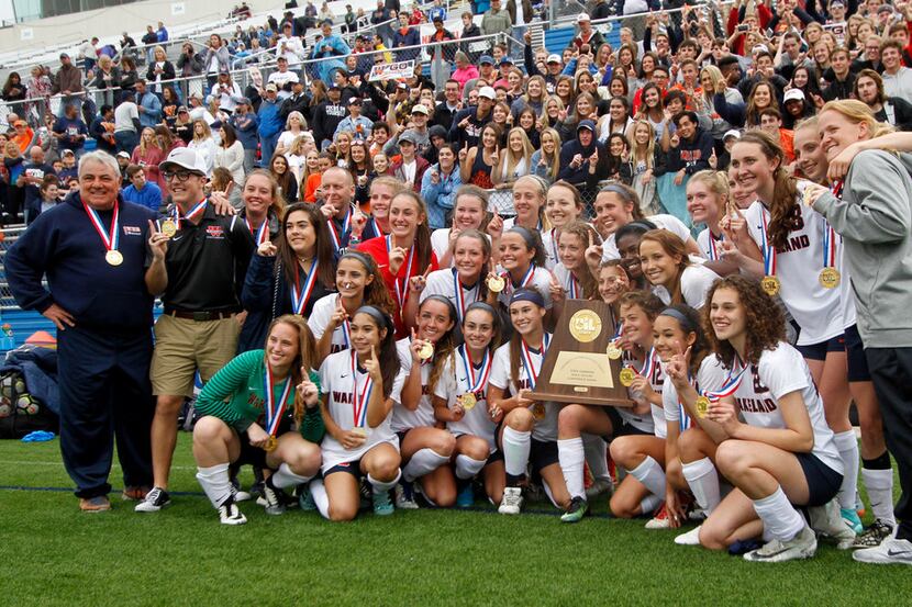 Members of the Frisco Wakeland team pose for a group photo after capturing the state...