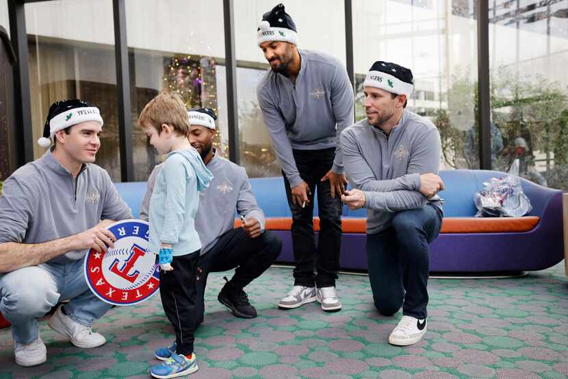 Texas Rangers pitcher Cody Bradford, from left, talks with Medical City Children’s Hospital...