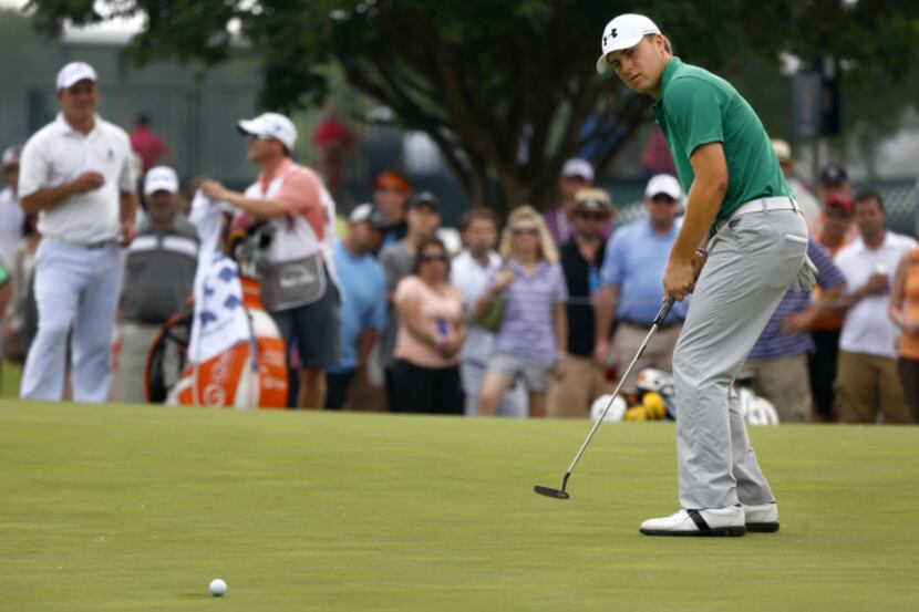 PGA Tour golfer Jordan Spieth, 19, of Dallas reacts as his ball rolls below and past the 9th...