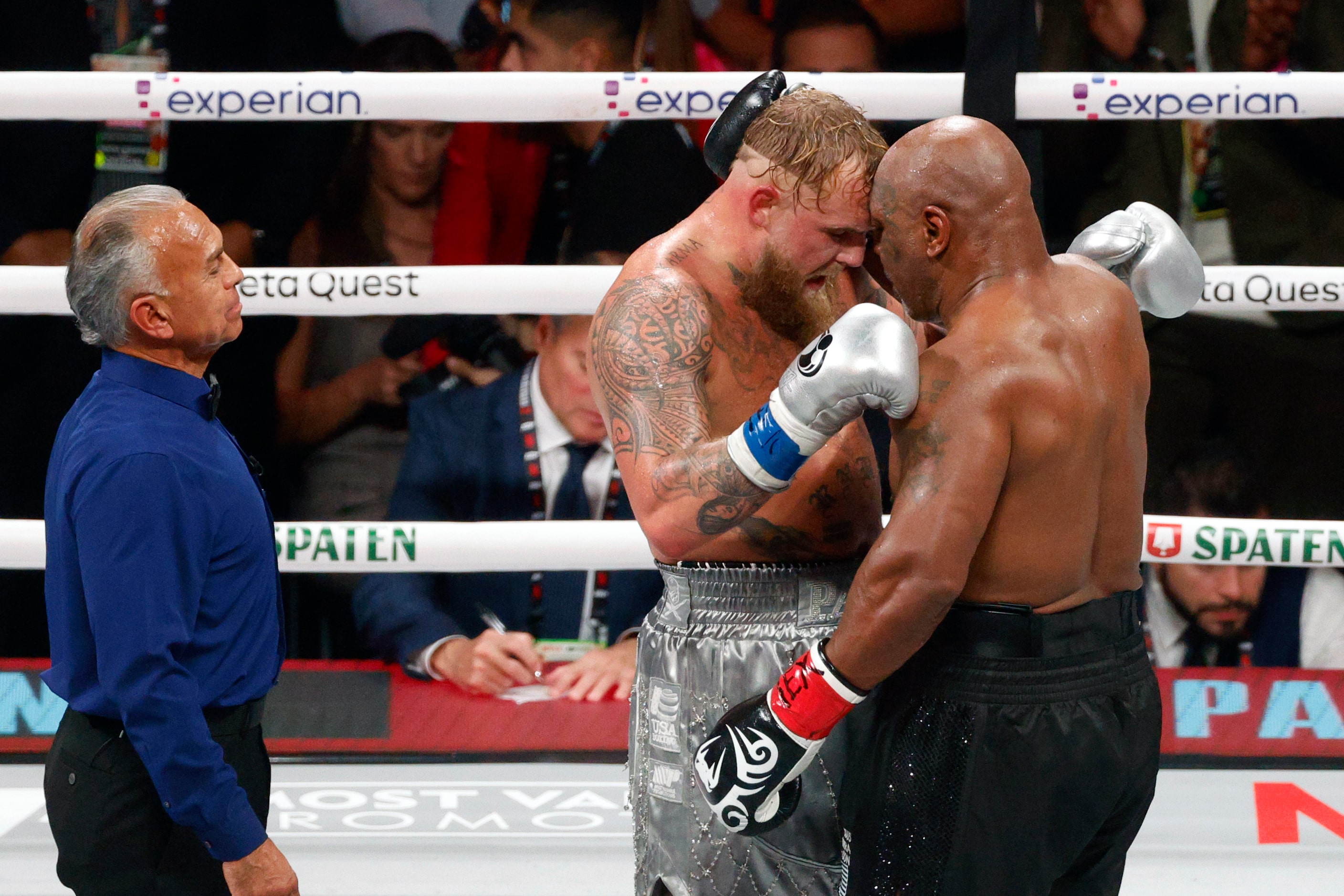 Jake Paul and Mike Tyson hug after a heavyweight boxing match, Friday, Nov. 15, 2024, in...