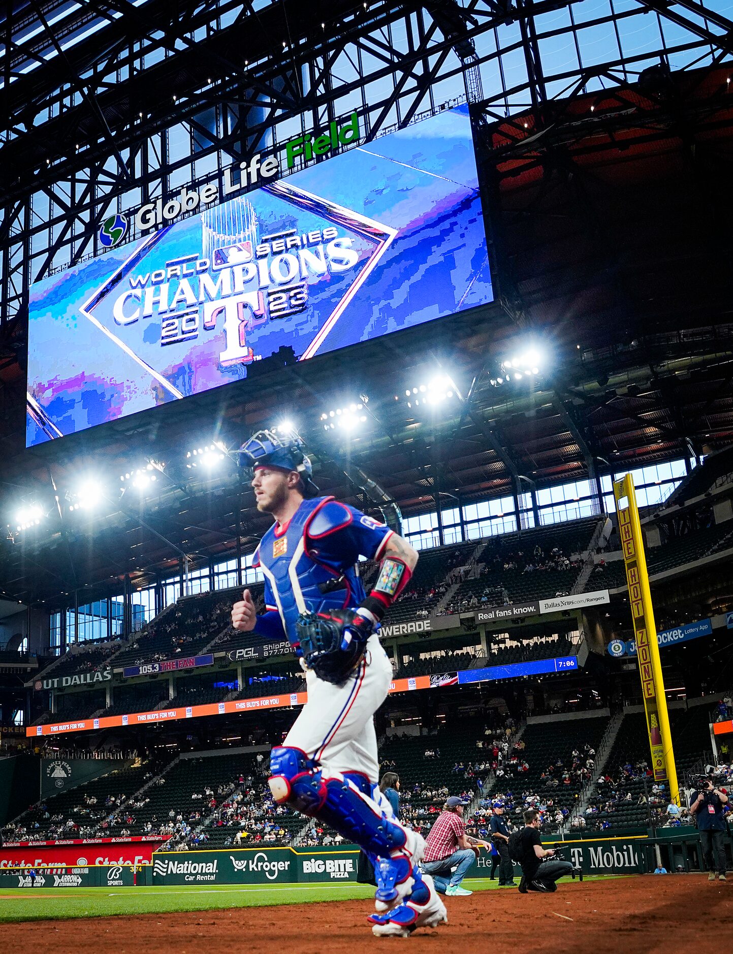 Texas Rangers catcher Jonah Heim takes the field before an exhibition baseball game against...