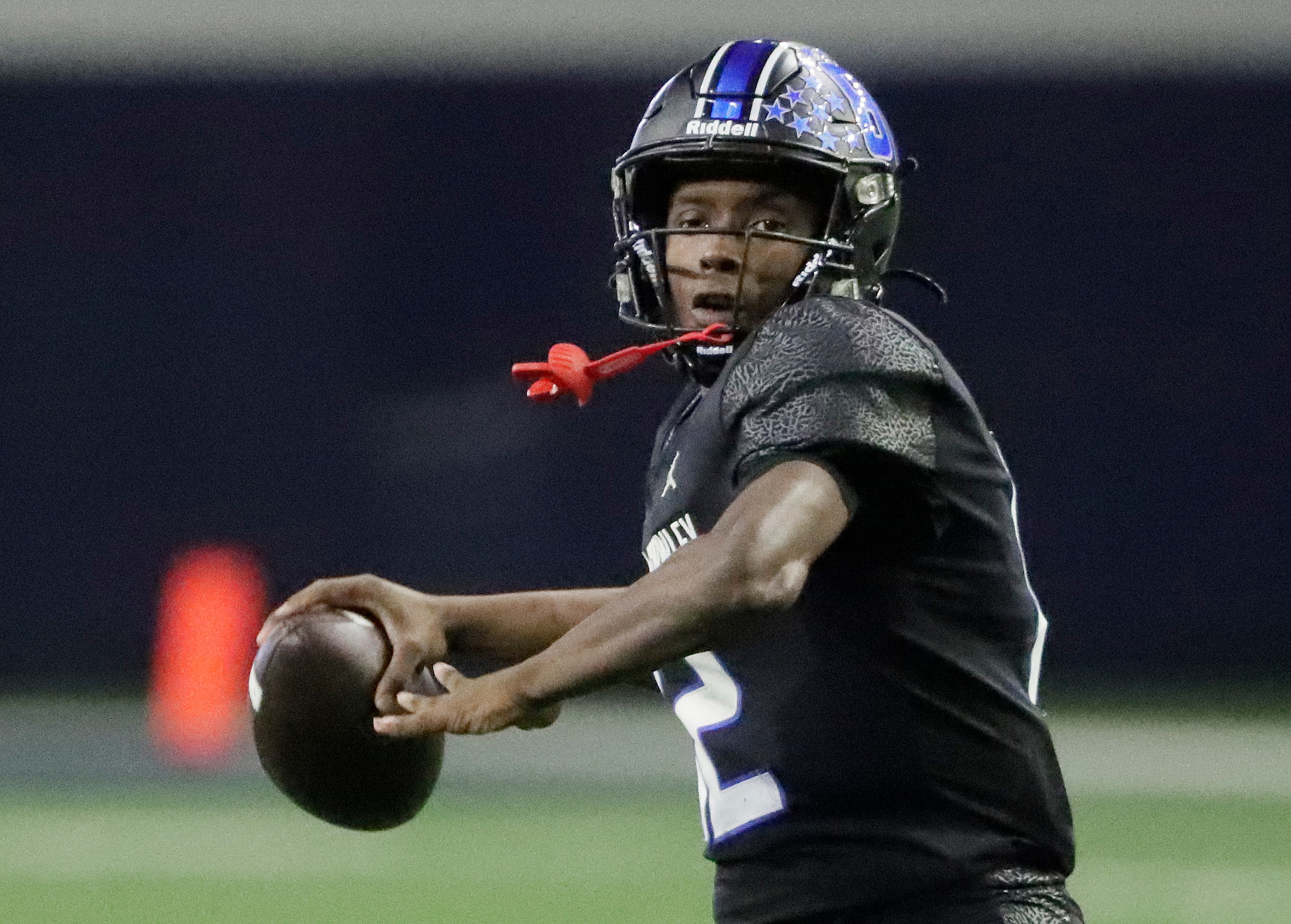 North Crowley High School quarterback Chris Jimerson (12) throws a pass during the first...