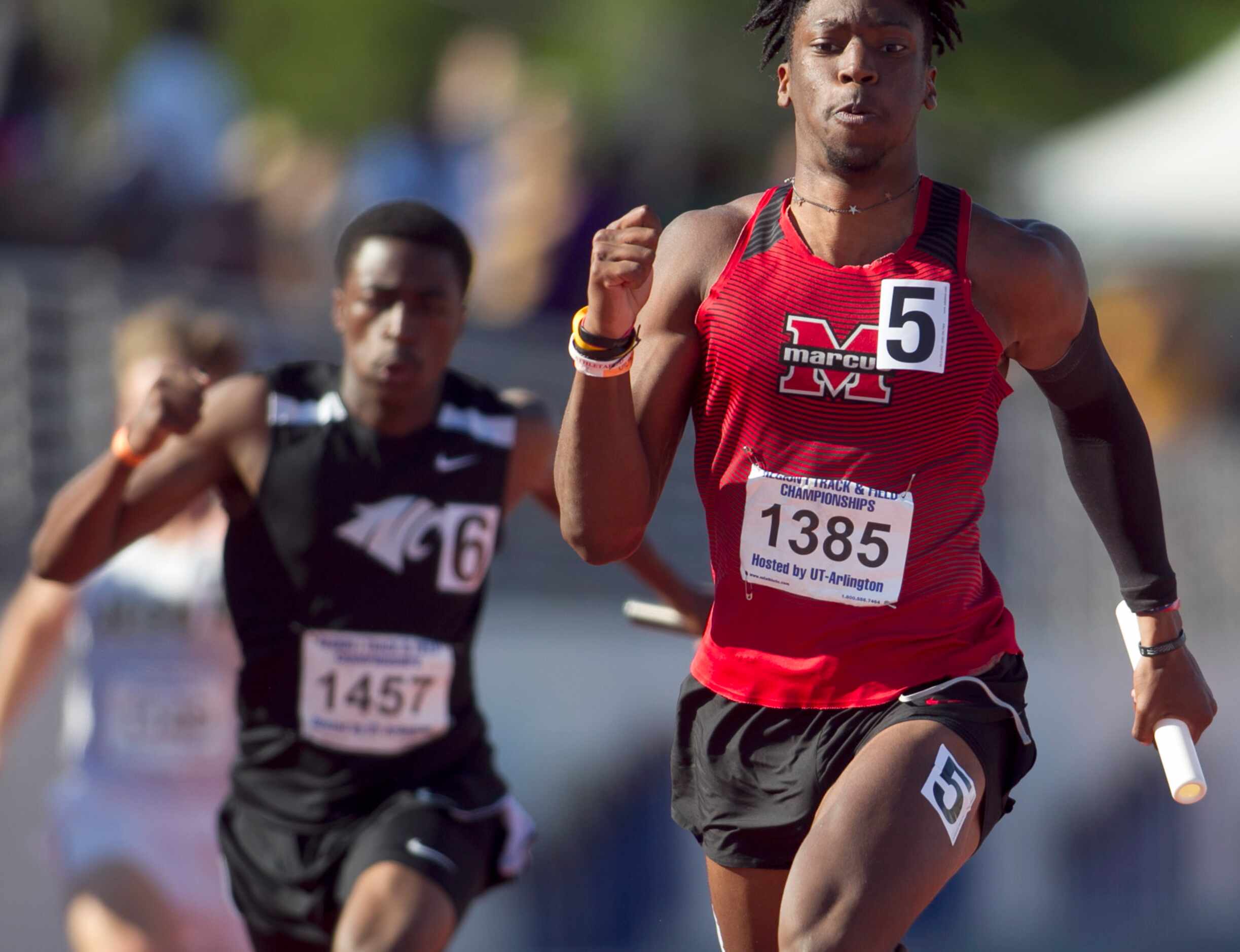 Flower Mound Marcus sprinter Michael Sturdivant finishes first to help his team win the...