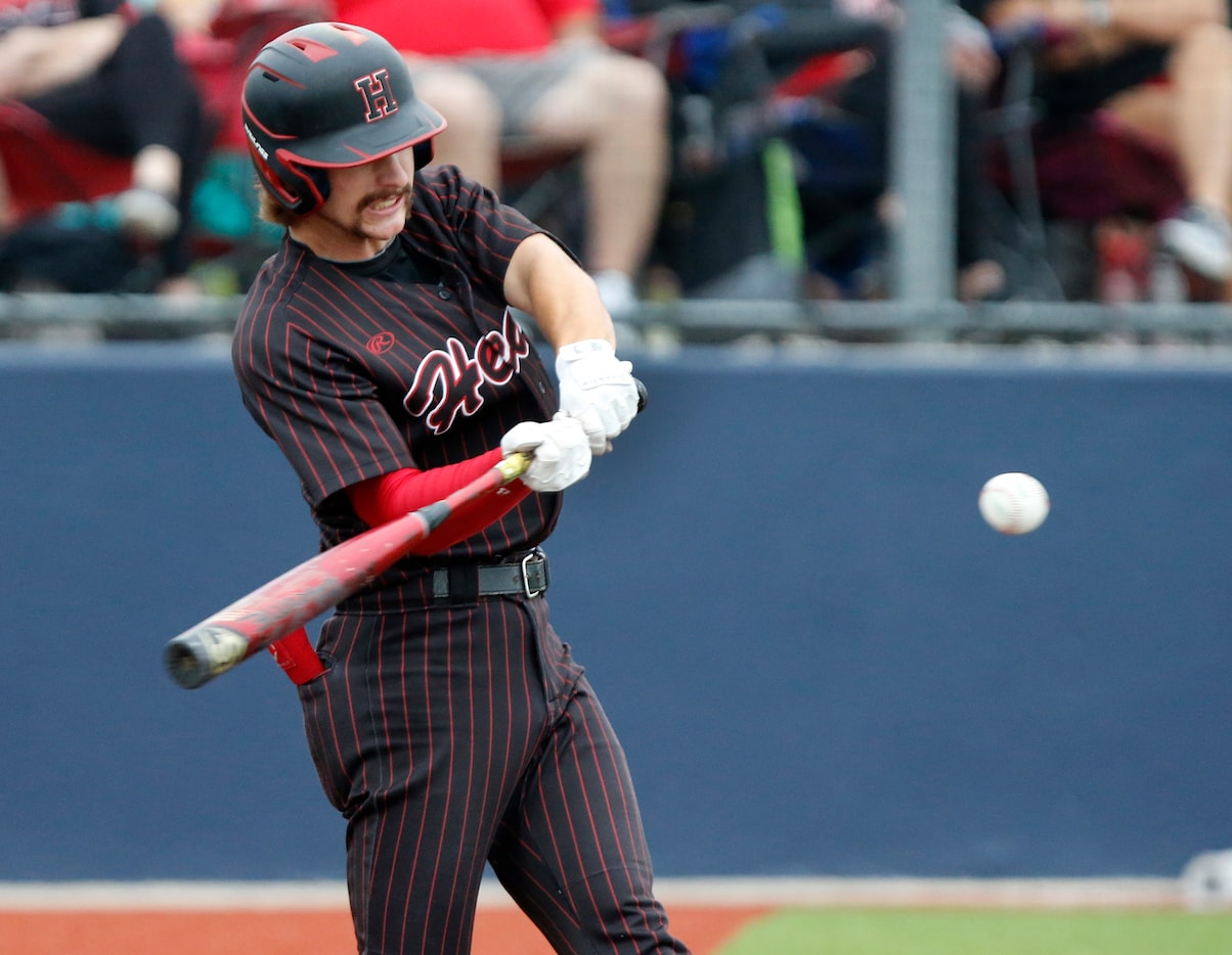 Heath shortstop Karson Krowka (5) hits a grand slam home run in the fourth inning as...