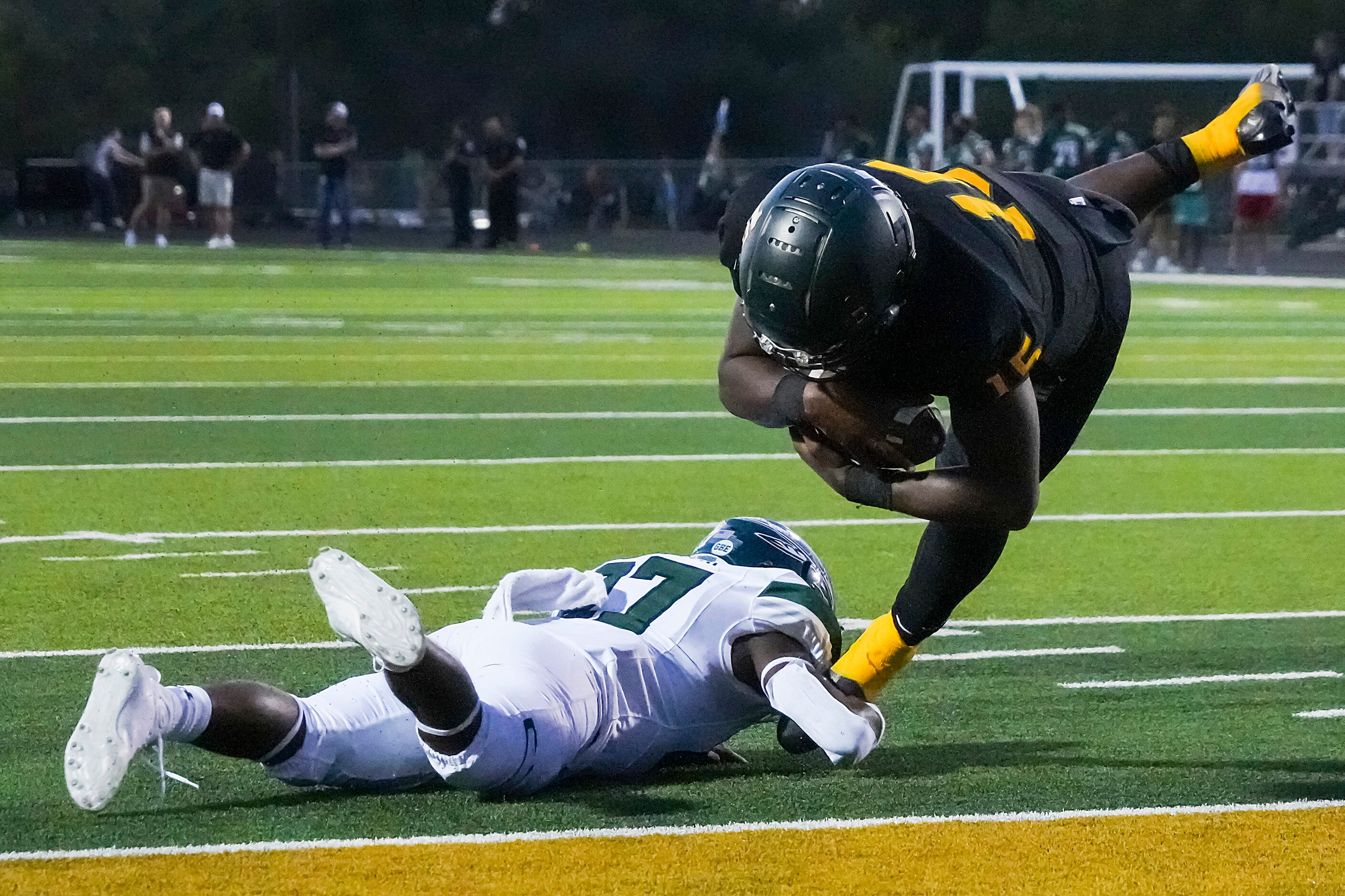 DeSoto quarterback Darius Bailey (15) gets past Waxahachie linebacker Robert Hannah Jr. ...