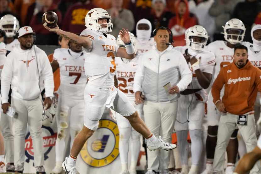 Texas quarterback Quinn Ewers (3) passes the ball on the fly during the first half of an...
