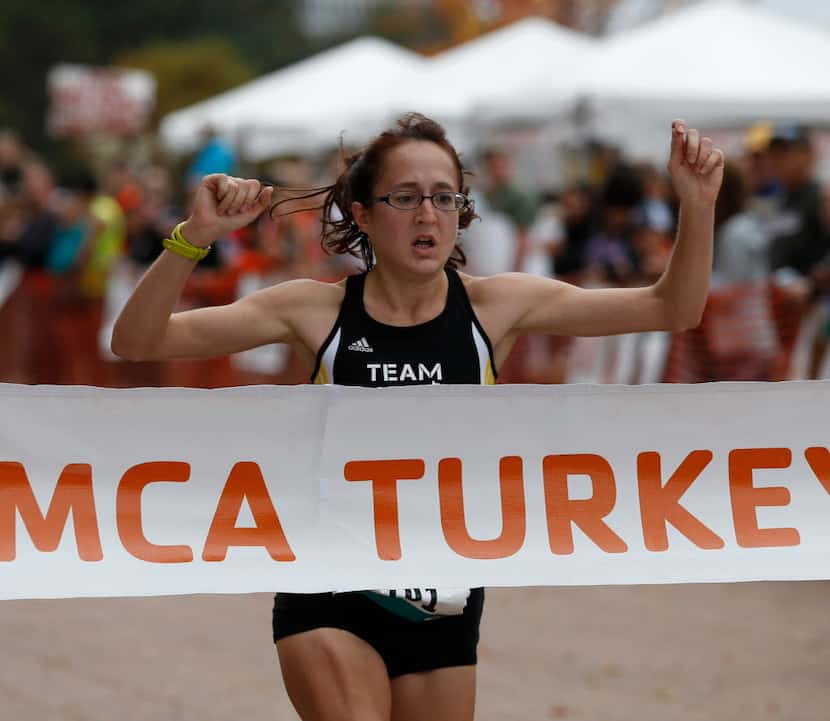 Ingrid Mollenkopf wins first place in the women's 8-mile run at the Dallas YMCA Turkey Trot...