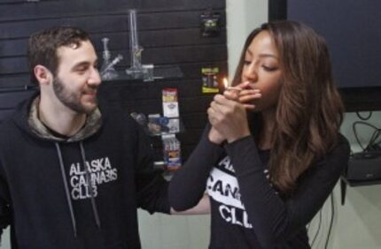  Peter Lomonaco, co-founder of the Alaska Cannabis Club, and CEO Charlo Greene share a joint...