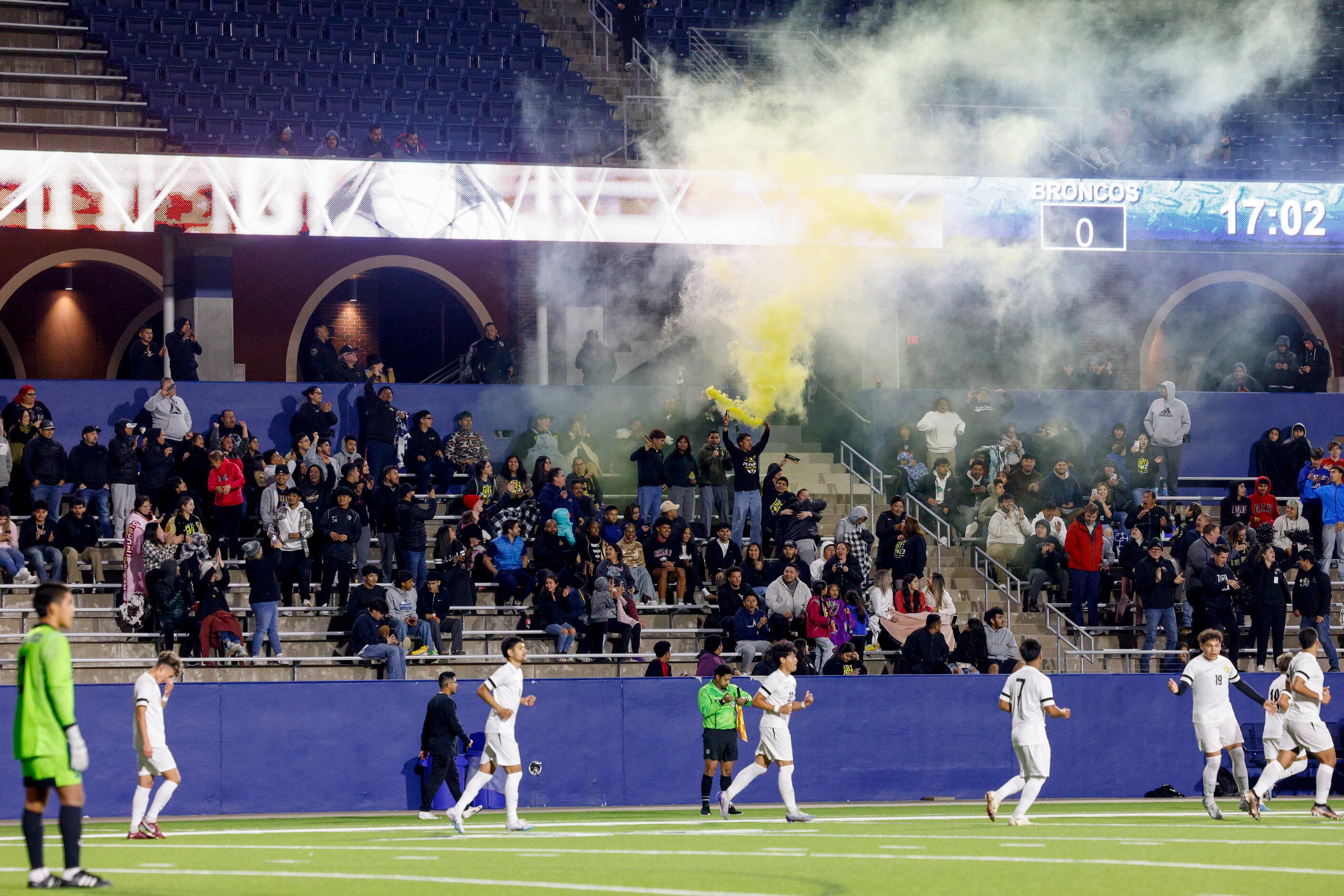 Irving fans celebrate a goal with a smoke bomb during the second half of a UIL 6A area...