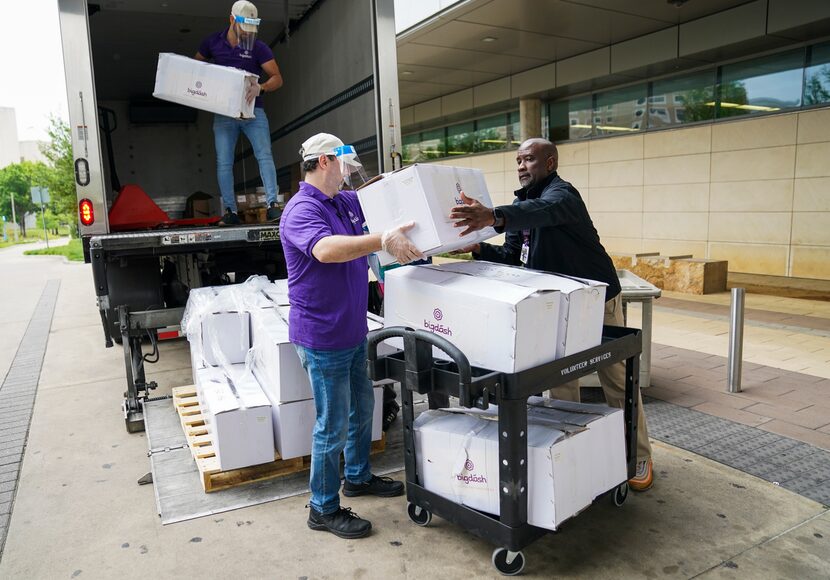 Abdullah Mahdi (left) and Kareem Alrefaai (center) of  Bigdash Ice Cream & Pastries drop off...